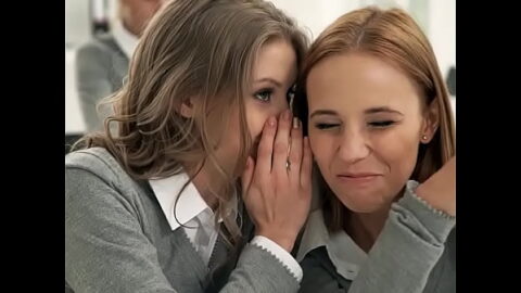 Two women share a lesbian moment in a dorm