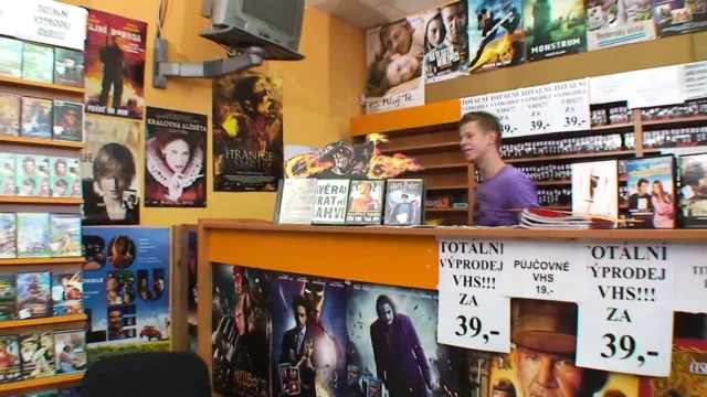 High heeled mature gets cum on tits while fucking in a dvd store