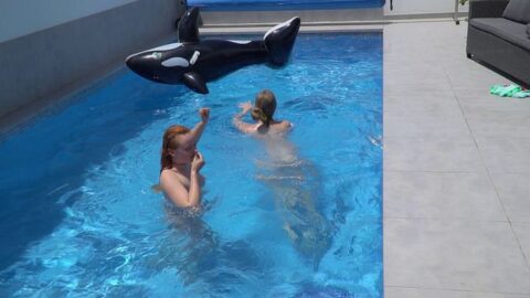 Two girls are having fun in the pool