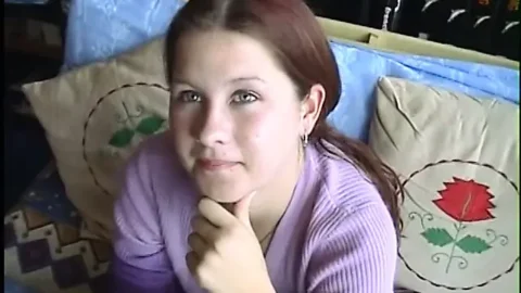 Young brunette strips and gives hard cock a hungry blowjob