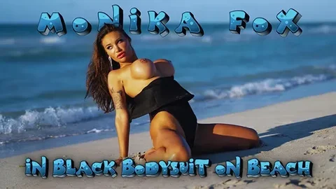 Woman in Black Bodysuit on Beach