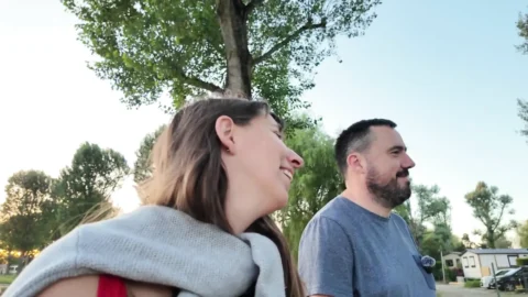 Fucking in a field near a campsite